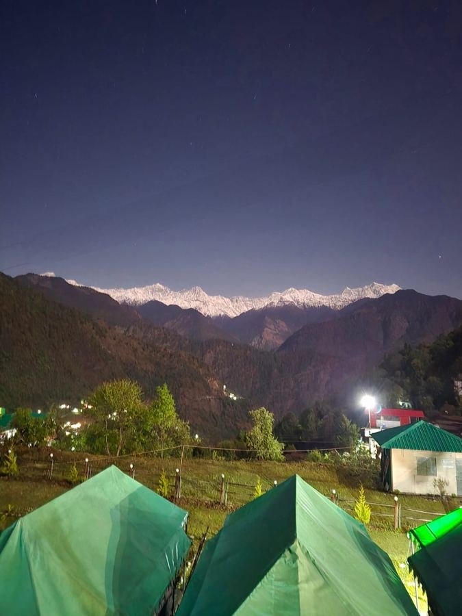 Snow peaks at night seen from the resort